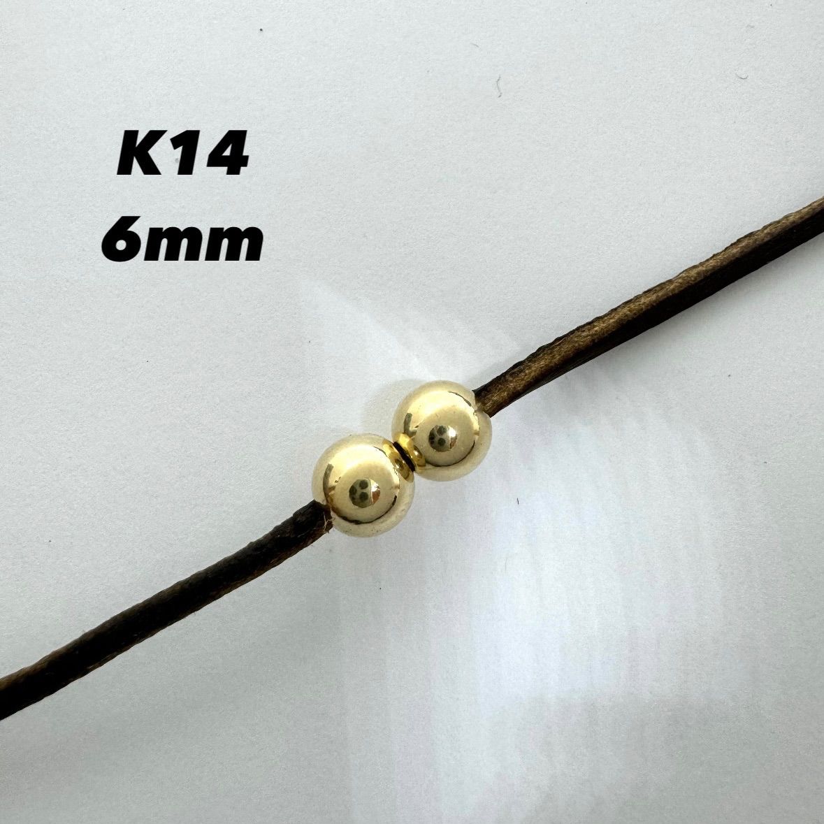 革紐通せますK14ビーズ 6mm 2個セット 金ビーズ　ゴールド