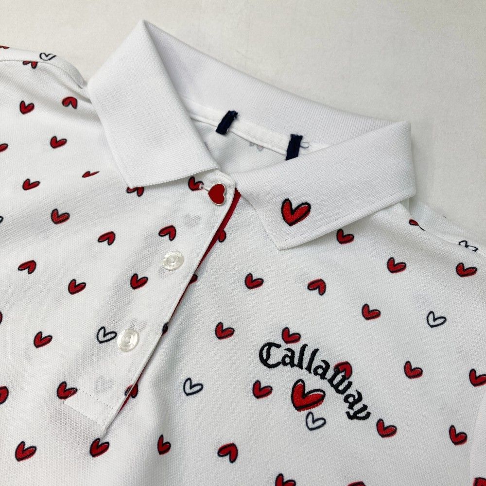 サイズ：L CALLAWAY キャロウェイ 2024年モデル 半袖ポロシャツ 刺繍 ハート 総柄 ホワイト系 [240101426301] ゴルフウェア レディース ストスト サイズ：L CALLAWAY キャロウェイ 2024年モデル 半袖ポロシャツ