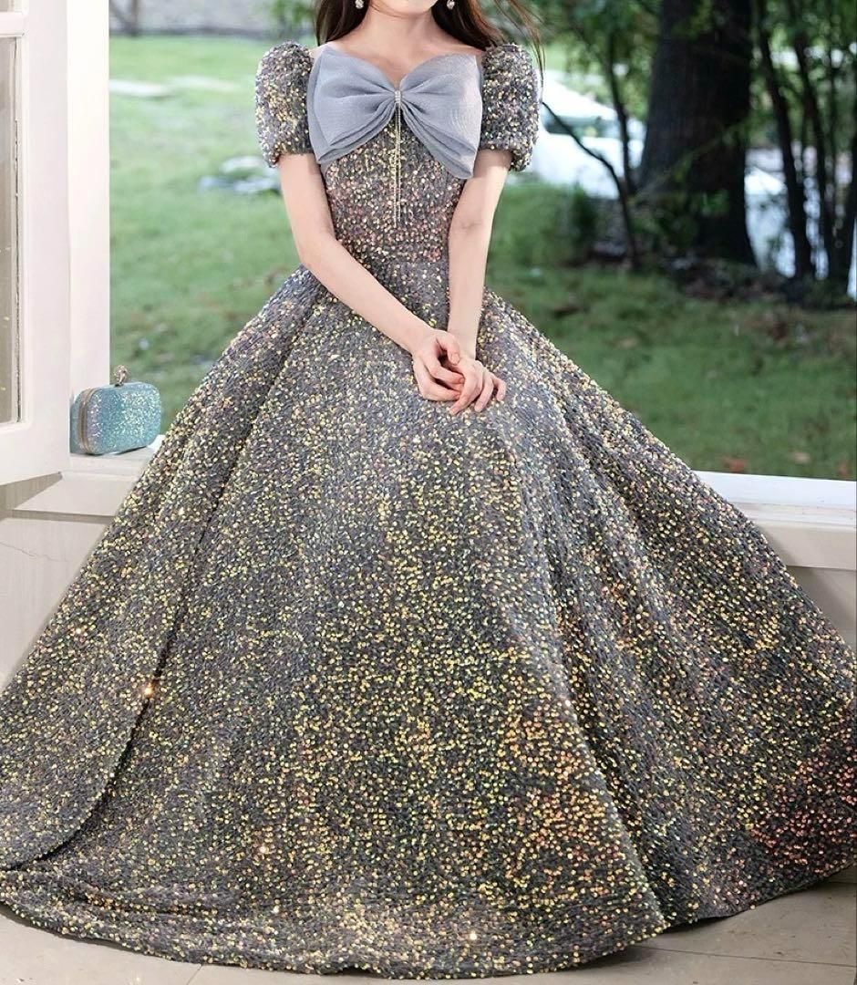 胸元リボンが可愛い 半袖のスパンコール イブニングドレス 胸元のリボンが可愛い シースルーの半袖のイブニングドレス
