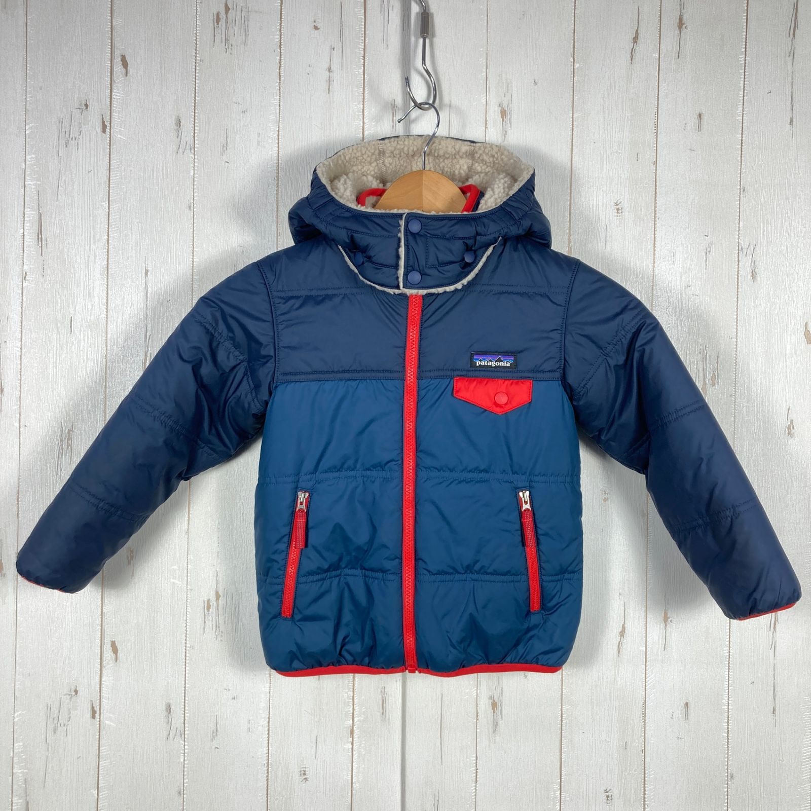 patagonia トリブルズフーディ ネイビー/レッド ベビー リバーシブル