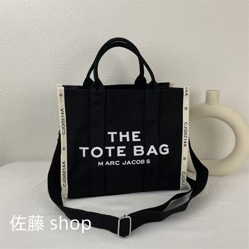 限定値下】マークジェイコブス Marc Jacobs バッグ トートバッグ レディース ミニ トラベラー グラフィック ロゴ トート ショルダーバッグ  斜め着用 キャンパス Mサイズ - メルカリ