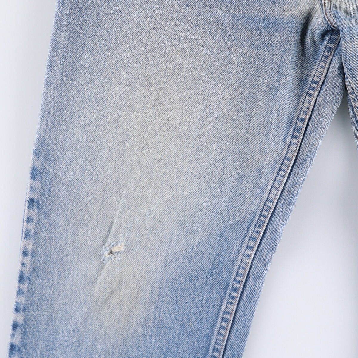 オレンジタブ テーパードデニムパンツ