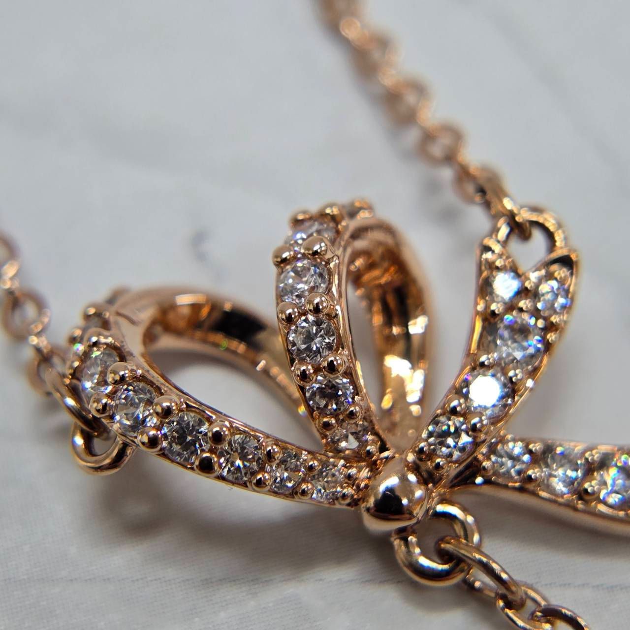 SWAROVSKI スワロフスキー リボンモチーフ ネックレス ピンクゴールド