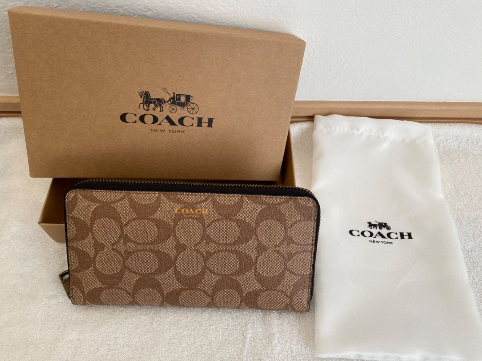 最大80％オフ！ COACH ラウンドファスナー長財布 C4452 IMAA8 ブラウン