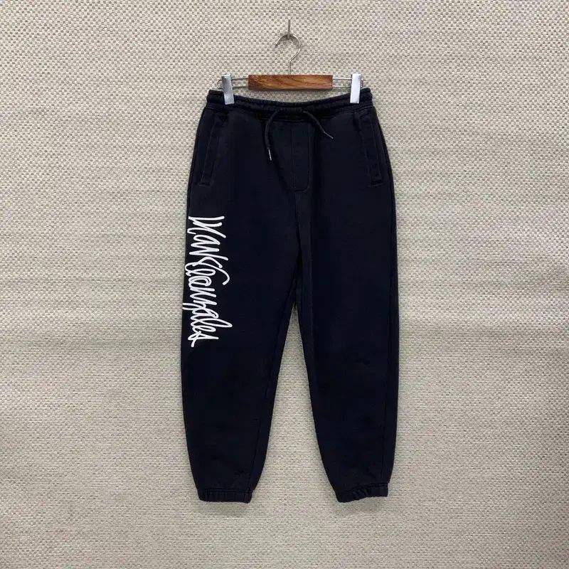 WHAT IT ISNT(ワットイットイズント) Mark Gonzales(マークゴンザレス) トラックパンツ クリーニングバー M K06859