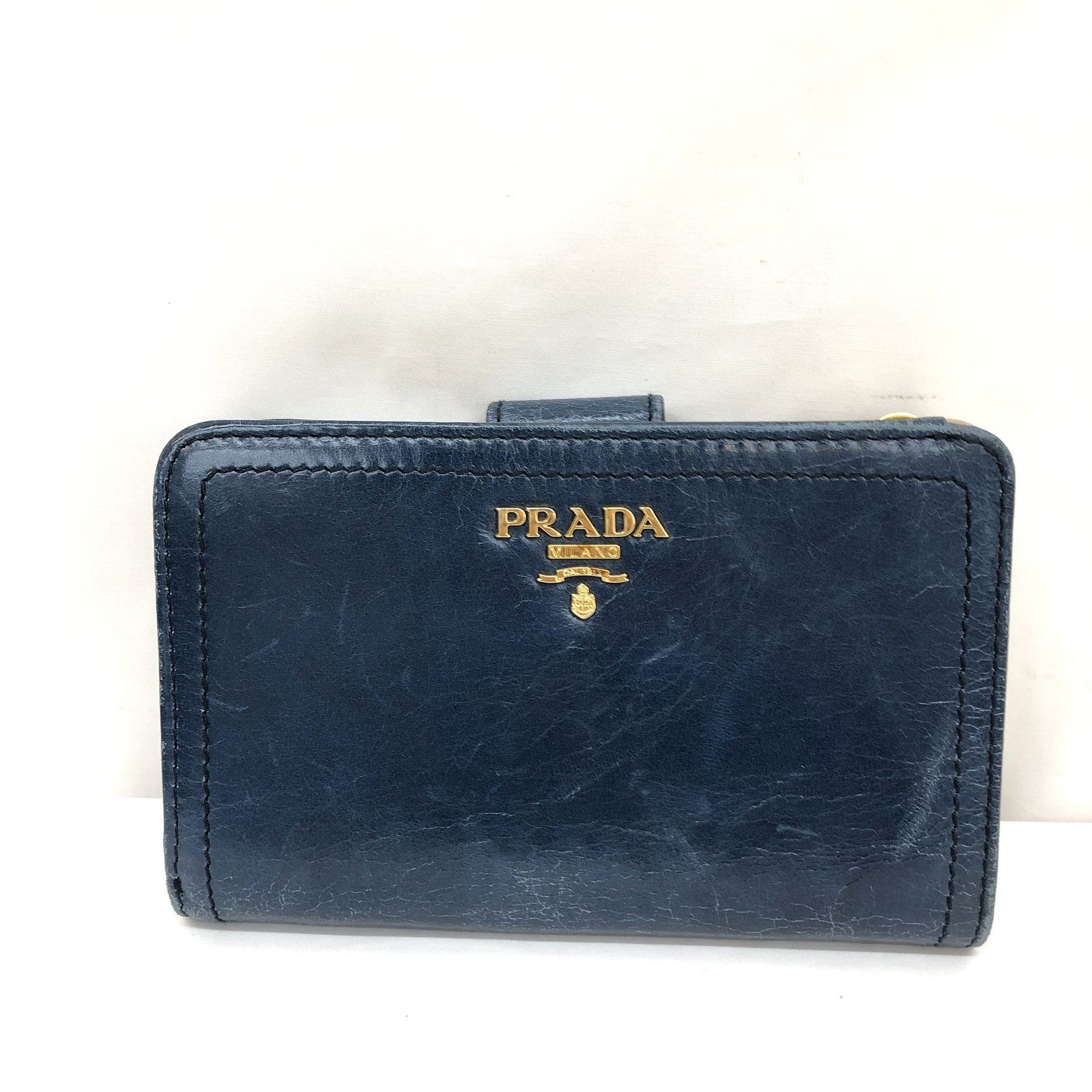 の公式オンラインストア PRADA プラダ 2つ折り財布 ロゴ金具 1M1225