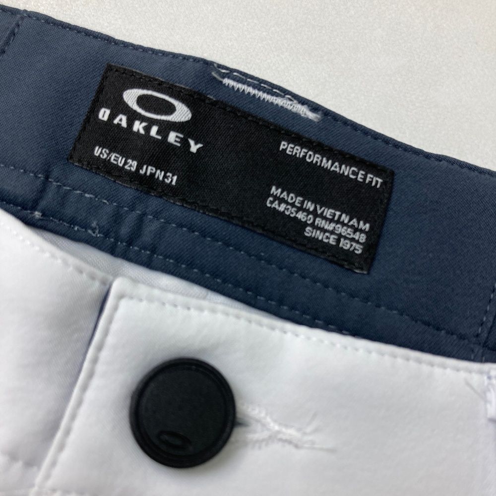 サイズ：31 OAKLEY オークリー FOA405751 ロングパンツ スカル刺  ホワイト系 [240101484854] ゴルフウェア メンズ ストスト サイズ：31 OAKLEY オークリー FOA405751 ロングパンツ スカル刺