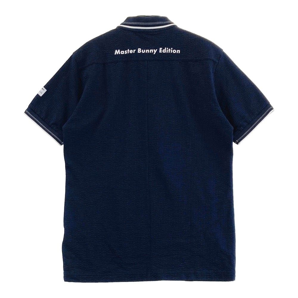 サイズ：4 MASTER BUNNY EDITION マスターバニーエディション  半袖ポロシャツ シアサッカー  ネイビー系 [240101425103] ゴルフウェア メンズ ストスト サイズ：4 MASTER BUNNY EDITION マスターバニーエディション