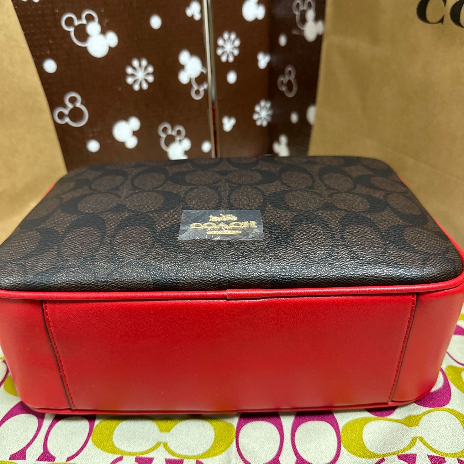 新品☆COACHショルダーバッグ PVCシグネチャー クロスボディF68168