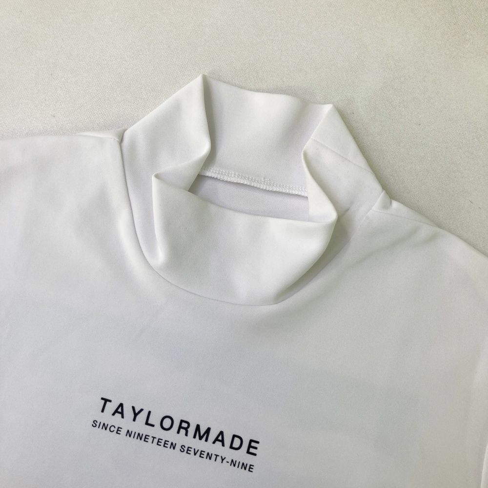 美品】テーラーメイド 半袖ハイネックシャツ 白 地模様 ネック一部黒