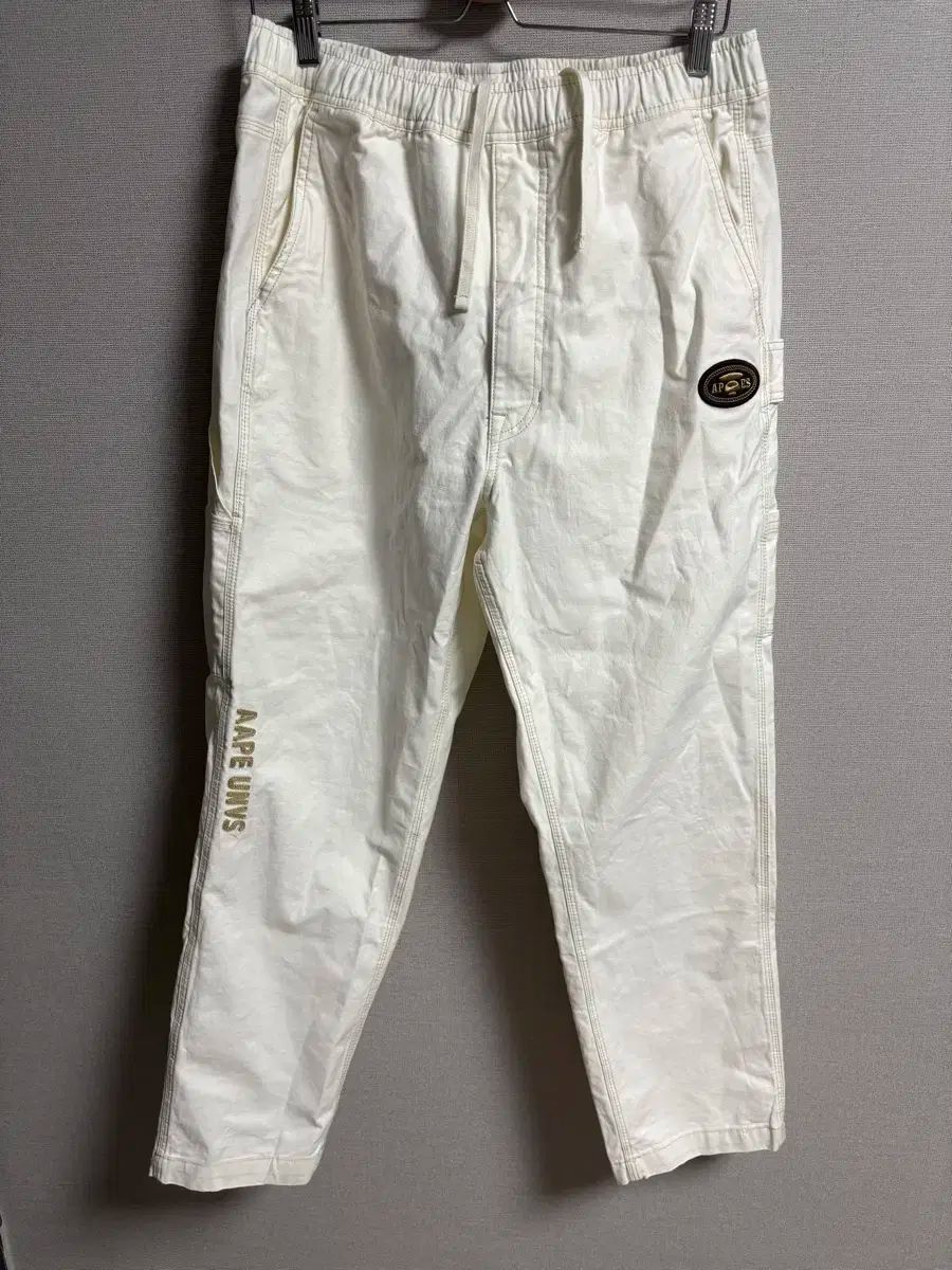  AAPEUNVS ムーンフェイス ロゴ リラックスフィット パンツ チノパン パンツ