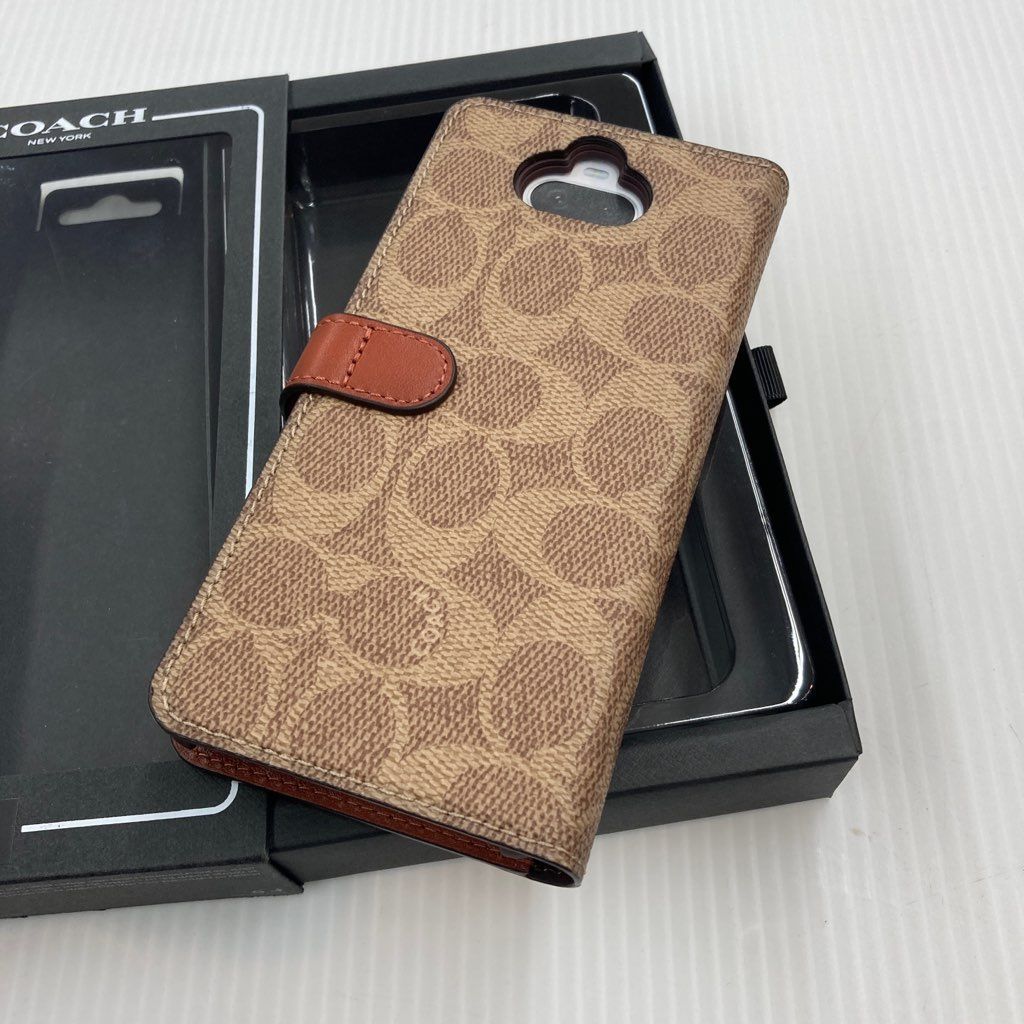 ○未使用○【Xperia 8用】 COACH ブックタイプケース／SIGNATURE Brown RS9C082T - メルカリ