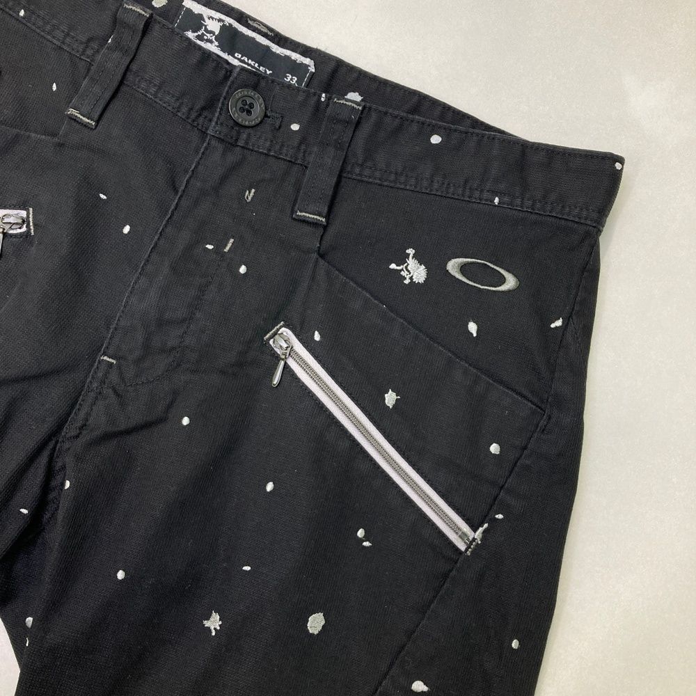サイズ：33 OAKLEY オークリー ロングパンツ 刺繍柄 ブラック系