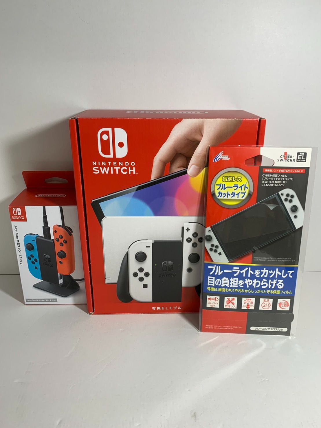 25.Nintendo Switch 有機ELモデル Joy-Conホワイト 充電スタンド 保護フィルム付き 併売品