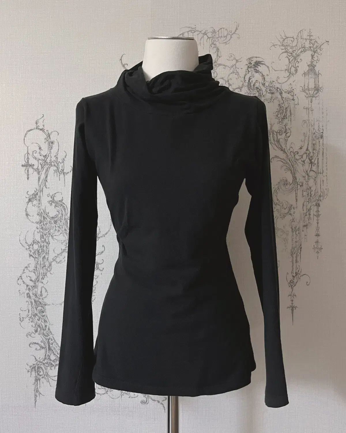 draped turtleneck