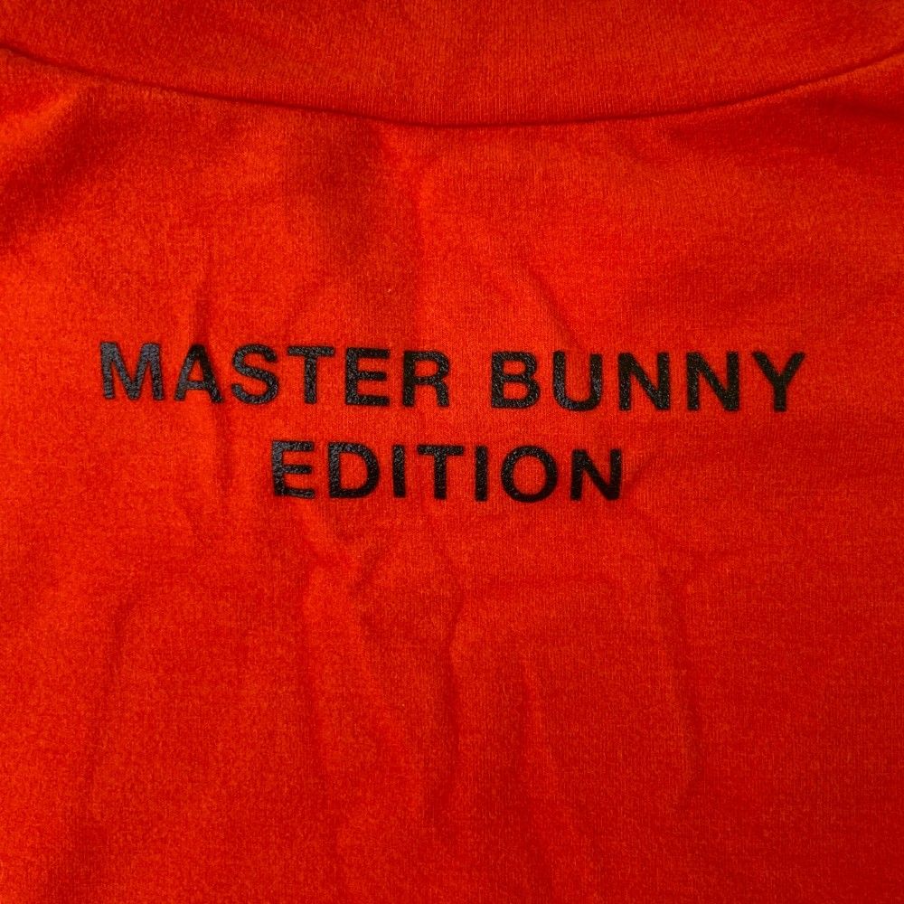 サイズ：4 MASTER BUNNY EDITION マスターバニーエディション 2023年モデル 起毛 ハイネック 長袖Tシャツ  オレンジ系 [240101466467] ゴルフウェア メンズ ストスト サイズ：4 MASTER BUNNY EDITION マスターバニーエディション