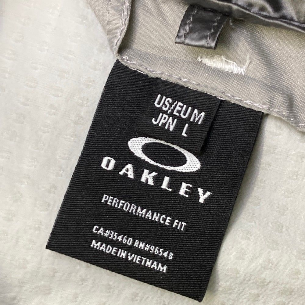 サイズ：L OAKLEY オークリー FOA402854 多機能 ブルゾン スカル刺繍  グレー系 [240101436210] ゴルフウェア メンズ ストスト サイズ：L OAKLEY オークリー FOA402854 多機能 ブルゾン スカル