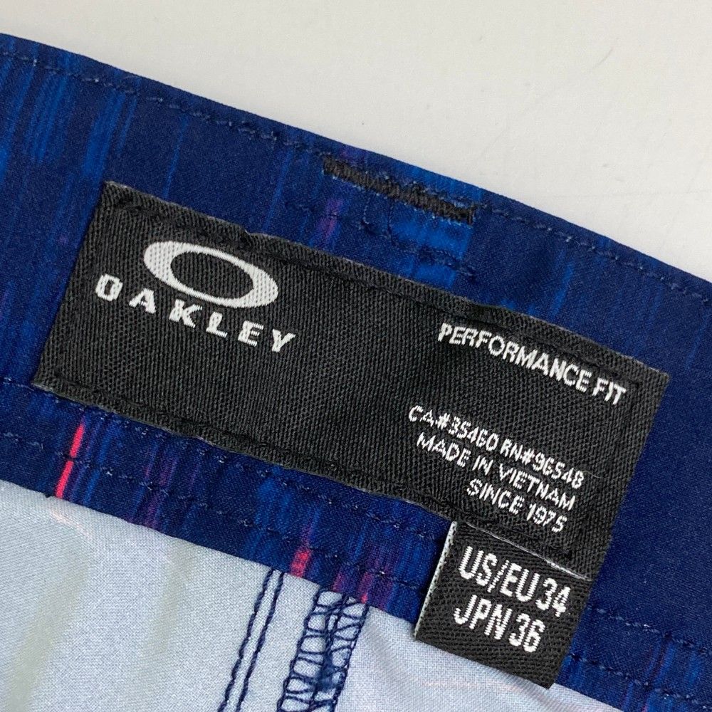 サイズ：36 OAKLEY オークリー FOA401634 ロングパンツ スカル刺繍 総柄 ネイビー系 [240101455307] ゴルフウェア メンズ ストスト サイズ：36 OAKLEY オークリー FOA401634 ロングパンツ スカル