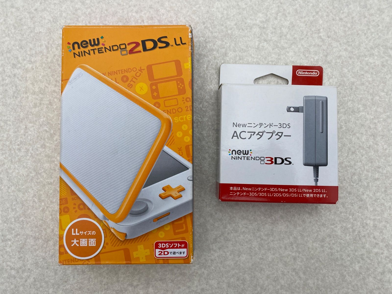 Newニンテンドー2DS LL ホワイト×オレンジ アダプター付き New