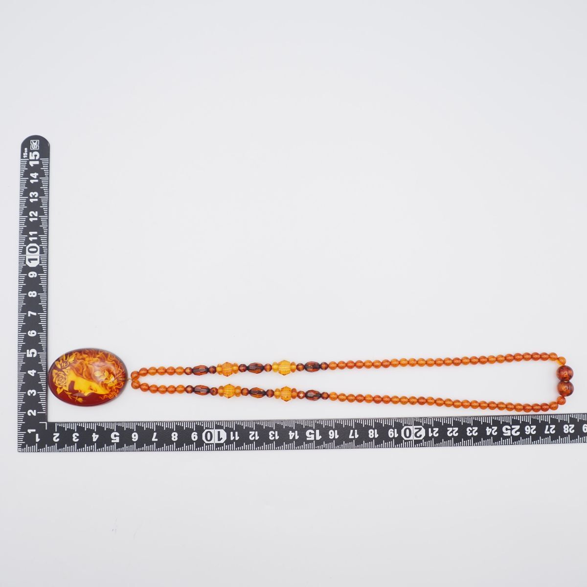 琥珀　インタリオ（裏彫り、かわせみ）のＫ１８ペンダント（小型、メキシコ産イエローアンバー） 還暦祝い 女性琥珀 ネックレス琥珀ペンダントK18　金プレゼントおしゃれインタリオかめ　レッドアンバー　赤琥珀　亀カメオ　 プレミアムアンバー　記念日贈物 | ジュエリーコタニ