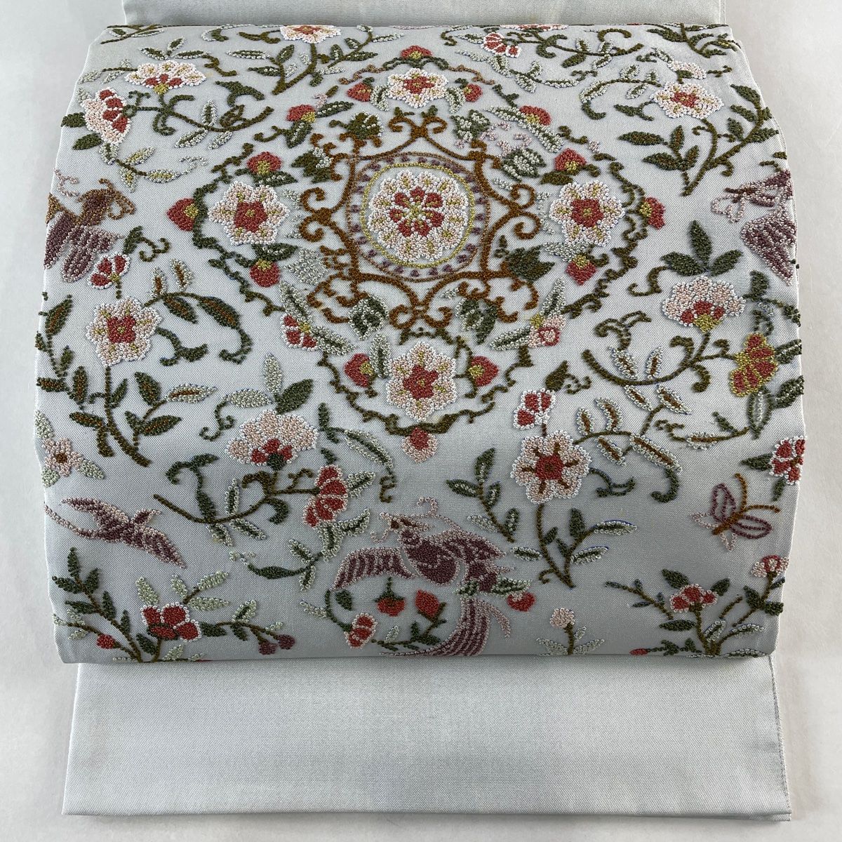 袋帯 名品 華文 草花 相良刺繍 水色 お太鼓柄 正絹