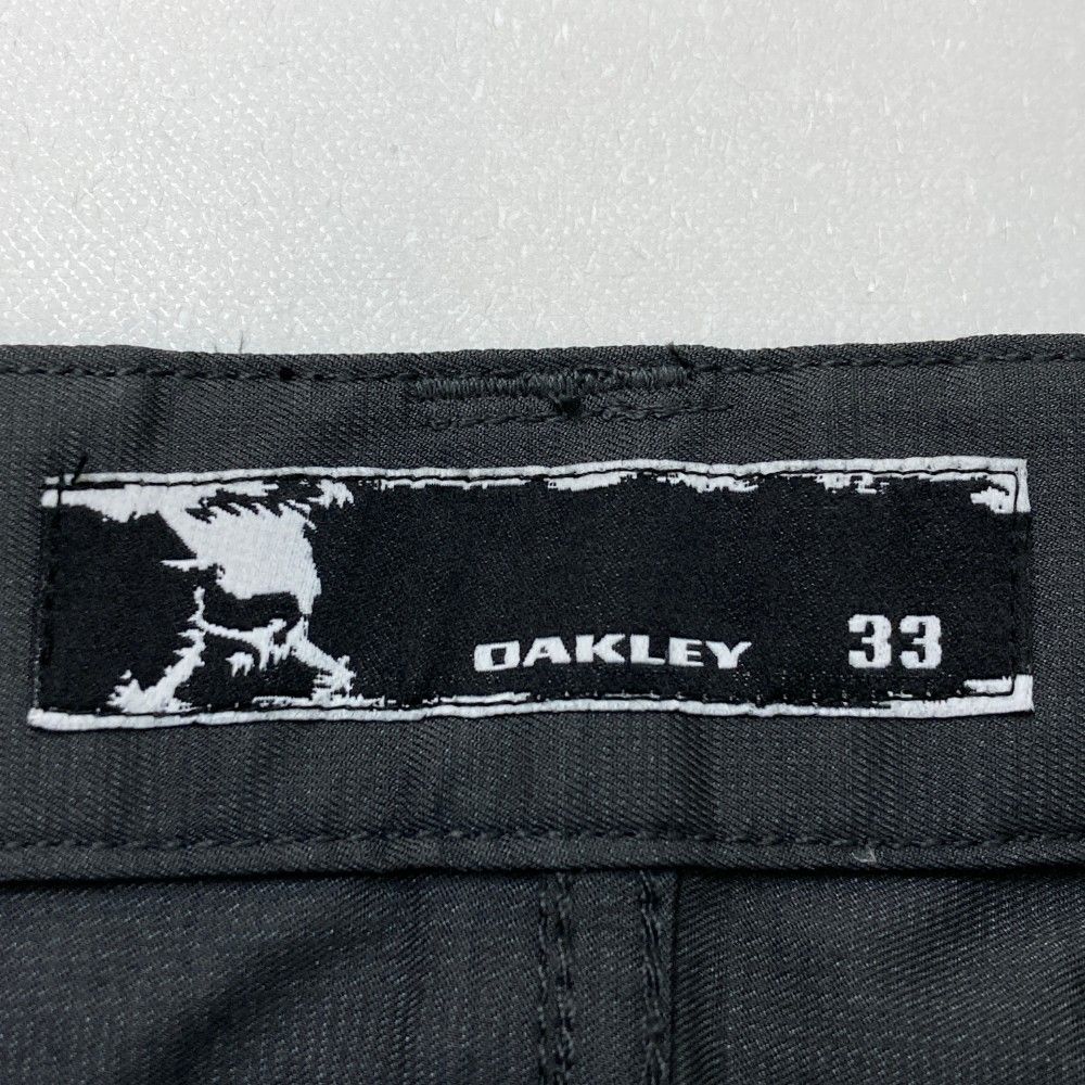 サイズ：33 OAKLEY オークリー ストレッチパンツ スカル刺繍