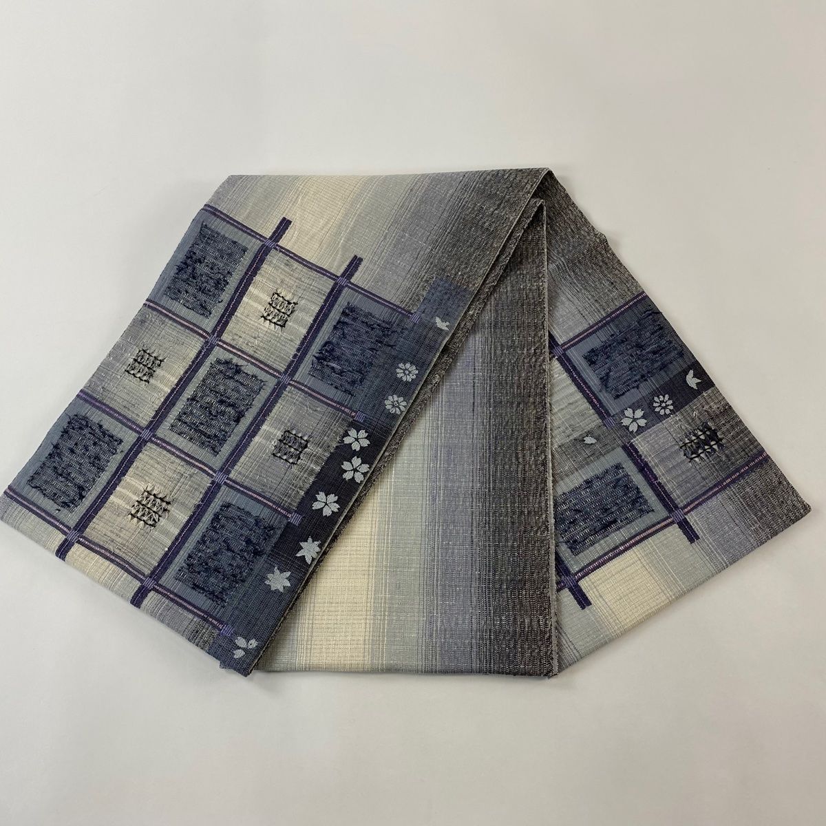 美品】 袋帯 秀品 紬地 やまと 桜 幾何学模様 金糸 青灰色 お太鼓柄