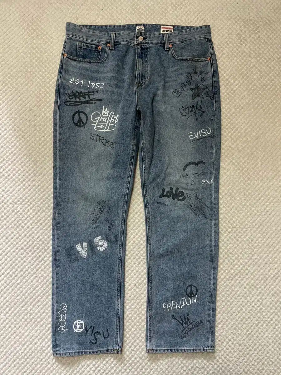38 EVISU EVISU エヴィス 手 クラフト グラフィティ デニム パンツ