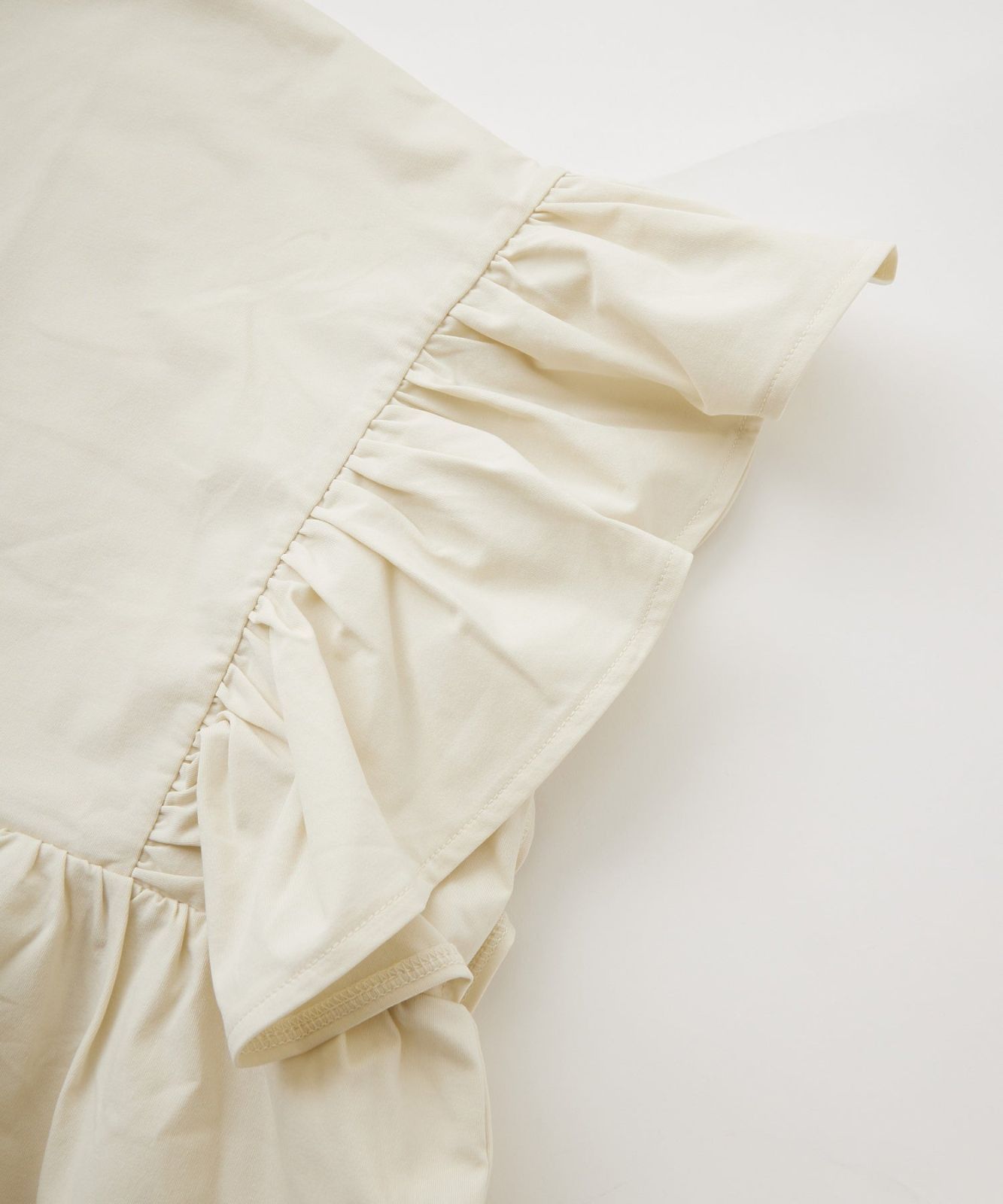 RUFFLE TUNIC