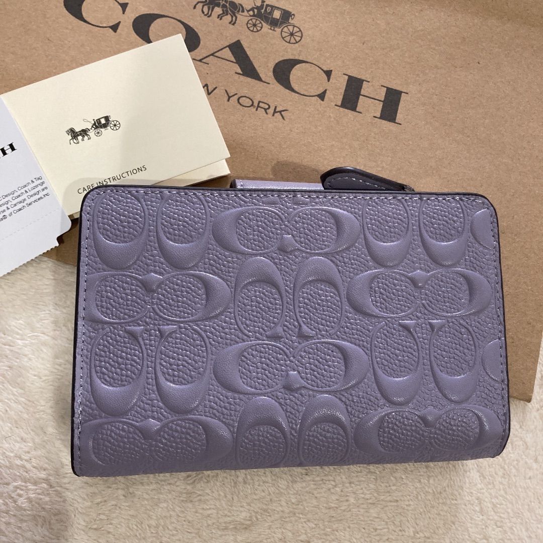 COACH コーチ 二つ折り 水色 エンボス シグネチャー - 折り財布