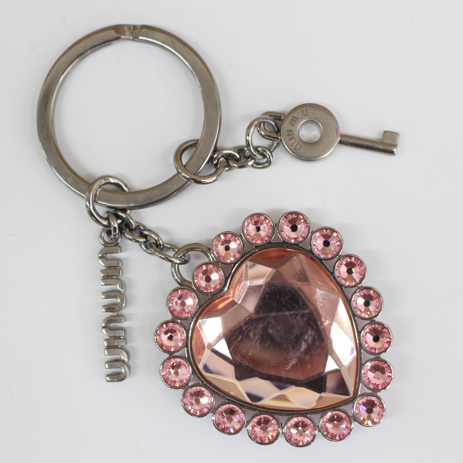 miu miu ハート型キーホルダー ピンク　クリスタル MIU MIU - MIUMIUリップケースキーホルダーの通販 by りんりん
