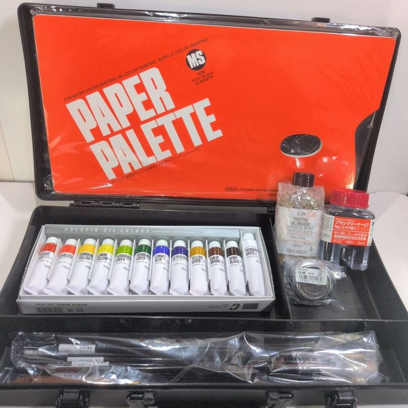 HOLBEIN Holbein Oil paint set including attaché case, large box, palette, paper, brushes, solvents, and other art supplies.