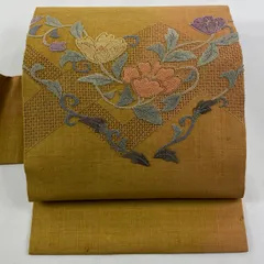 名古屋帯 秀品 紬地 草花 幾何学 刺繍 山吹茶色 正絹 【中古】