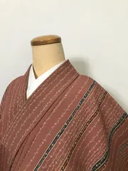 【中古】Mサイズ 小紋 化繊 曙色地に枝花模様
