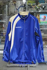 DIADORA（ディアドラ）／アシンメトリートラックジャケット ブルー×ベージュ×ホワイト／サイズO（XL相当）