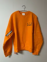 M IAB Studio 斗山 スウェット オレンジ