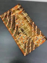 黒地に波と花と格子柄の華やかな袋帯