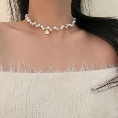 エテ（ete）のクロス＆パールモチーフのピンクゴールドカラー 
