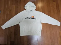 ellesse アイボリー ロゴ フーディー