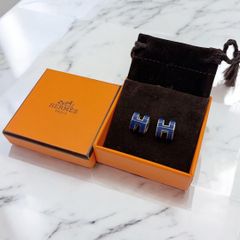 HERMES 黒青オーバル型ピアス - メルカリ