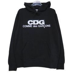 M新品未使用限定品CDG ホログラフィックロゴ フーディパーカー - メルカリ