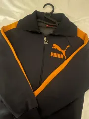 プーマ オレンジ ジップアップ トラックジャージ
