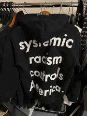 DENIM TEARS（デニムティアーズ） racism フードTシャツ