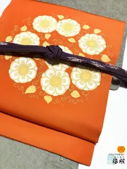【中古】 名古屋帯 正絹 オレンジ色地に唐花模様 お太鼓柄 九寸 nb 