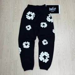 DENIM TEARS (デニムティアーズ) スウェットパンツ