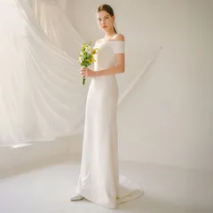 【新品・未使用】裾が垂れ下がったフレンチスタイルのウェディングドレス。セクシーなバックレス、ウエストにフィットしたブライダルガウン