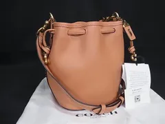 ■新品■未使用■ COACH コーチ CJ835 カミラ レザー 巾着型 ショルダーバッグ クロスボディ レディース オレンジ系 FV6985