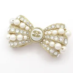 CHANEL(シャネル) ブローチ美品  ココマーク ゴールド×クリア×白 リボン
