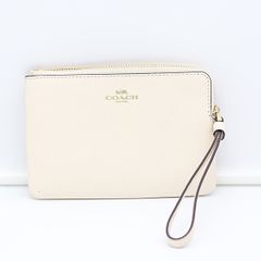 ♥COACH ベージュ レザー ポーチ 保存袋付き - メルカリ