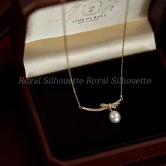 ネックレス ペンダント ゴールドカラー 金色 リボン フェイクストーン キラキラ パール 可愛い 個性的 レディース ジュエリー 大人かわいい デイリー ガーリー フェミニン イベント パーティー